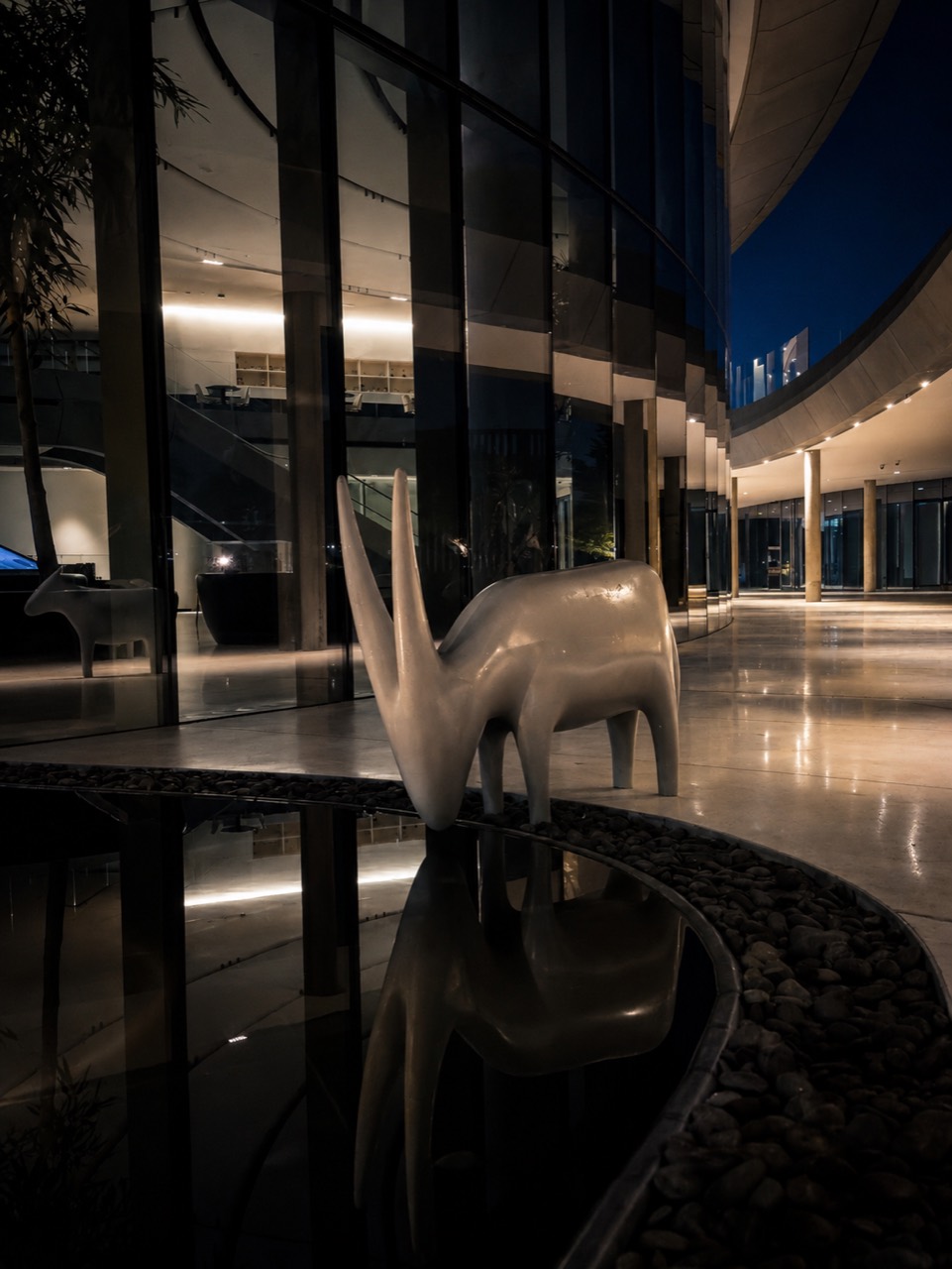 Night architecture reflection with sculptural form